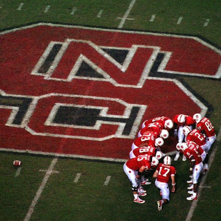Players huddle on the field