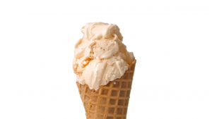 Banana pudding ice cream on a waffle cone