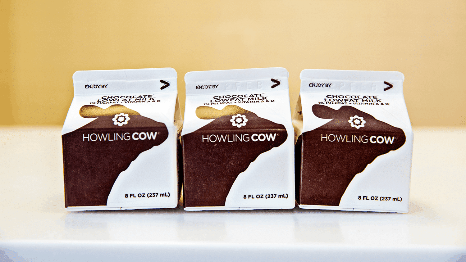 Three cartons of Howling Cow chocolate milk
