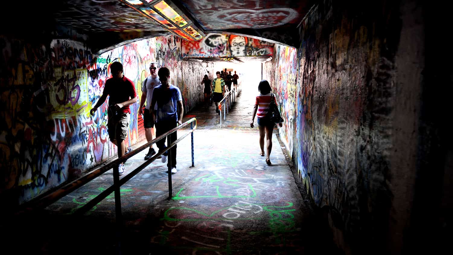 Crowds of students pass through the shadowy Free Expression Tunnel.