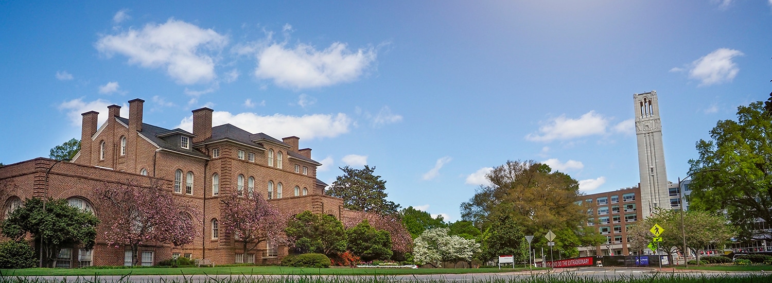 The exterior of Holladay Hall, with a view of the nearby Memorial Belltower.