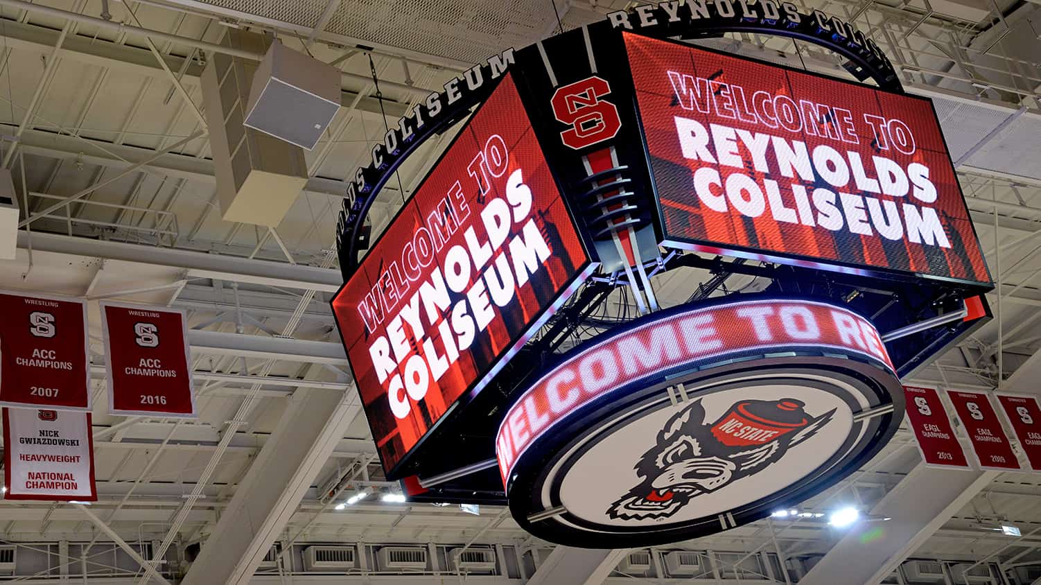 A jumbotron reads "Welcome to Reynolds Coliseum."