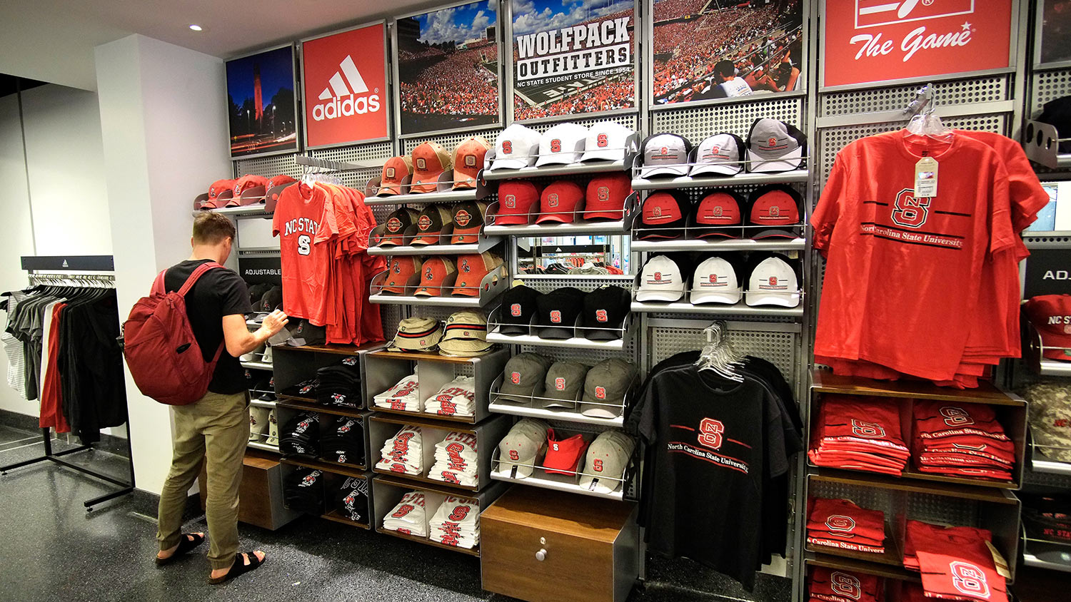 A student checks out Wolfpack outfitters at the Talley Student Union.