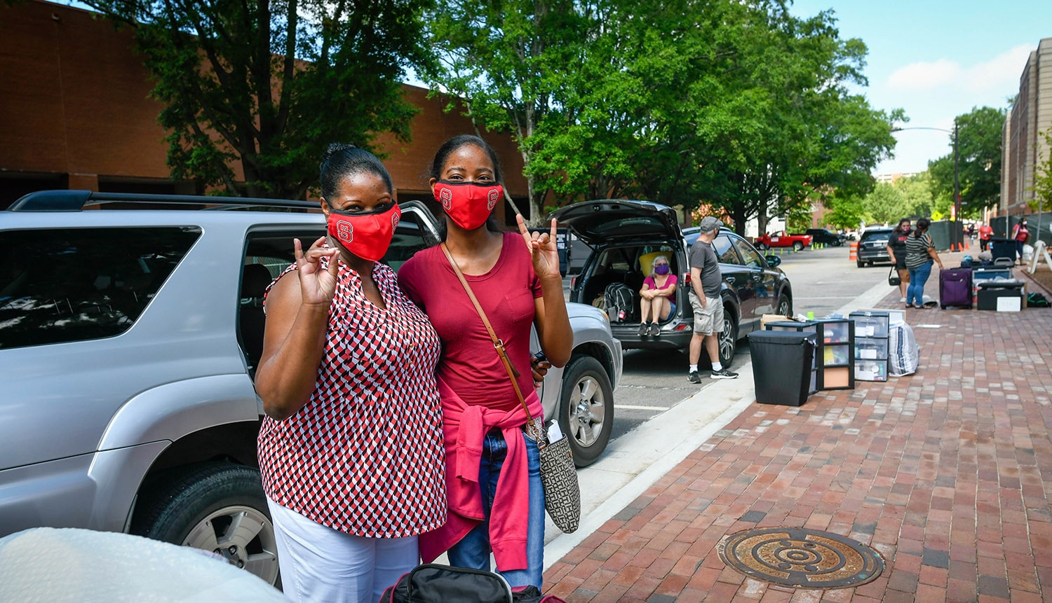 Incoming NC State students and their families help to move into student housing