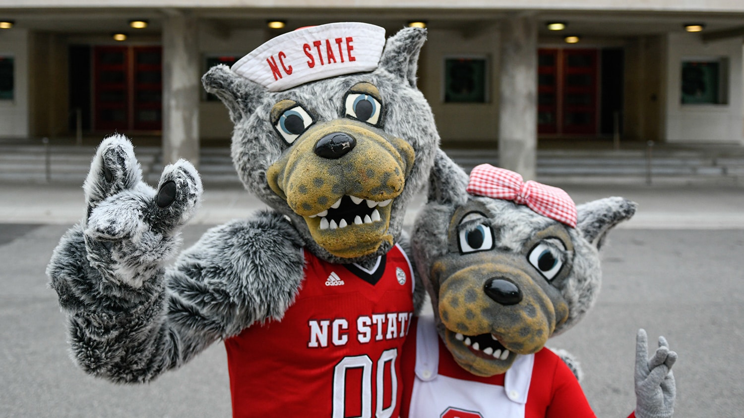 Mr. and Ms. Wuf outside of Reynolds Coliseum.
