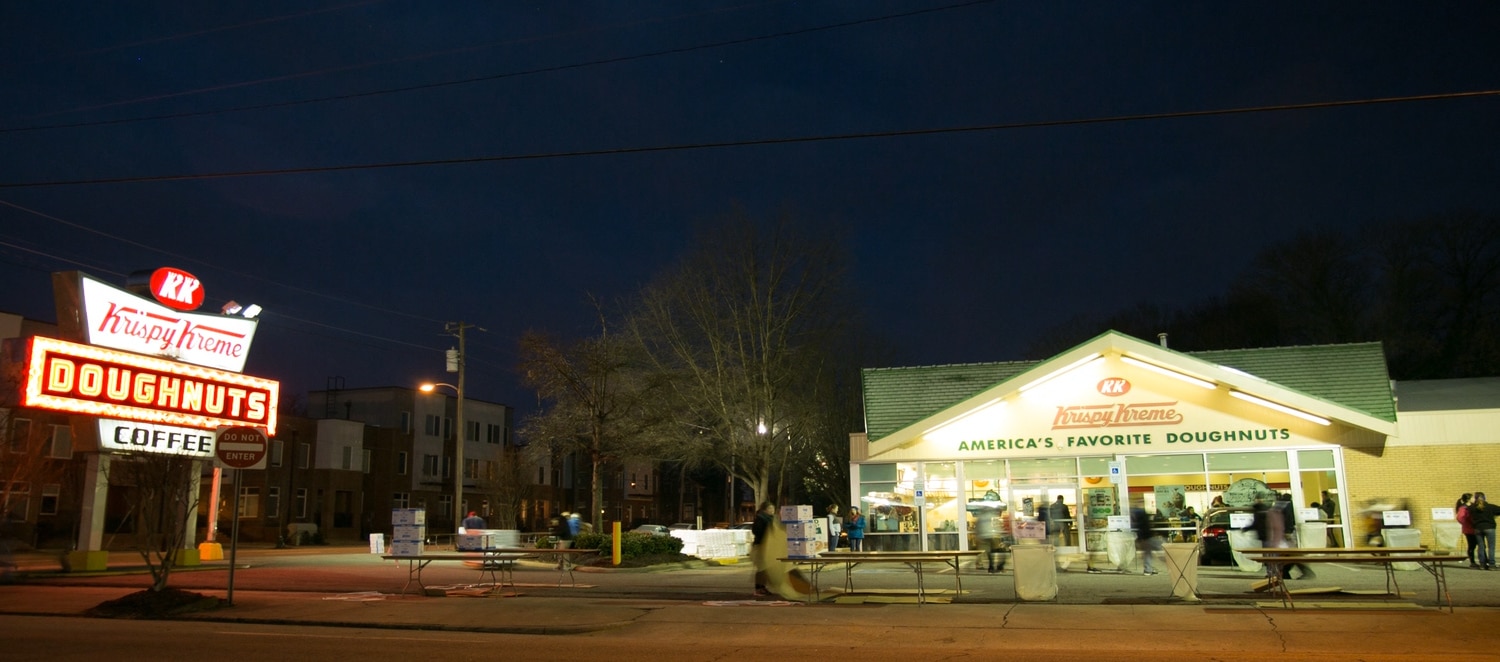 A view of the exterior of Krispy Kreme early in the morning.