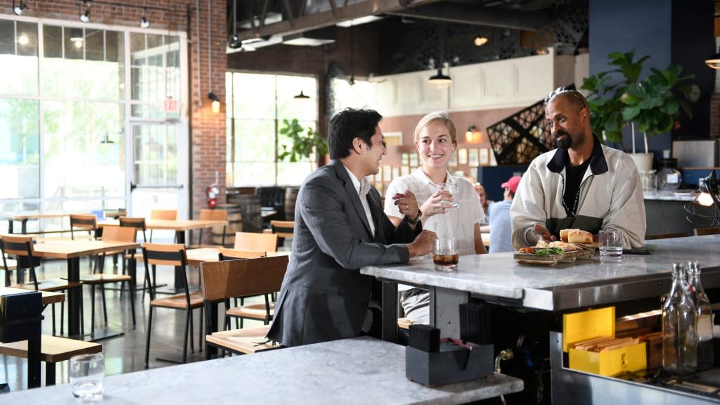 NC State alumni enjoy a drink and each others company at a local restaurant.