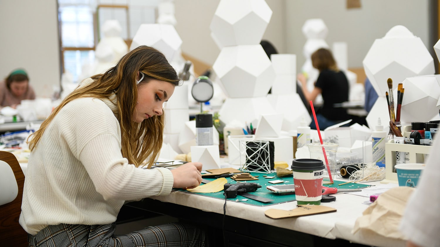 A woman works in the design lab.