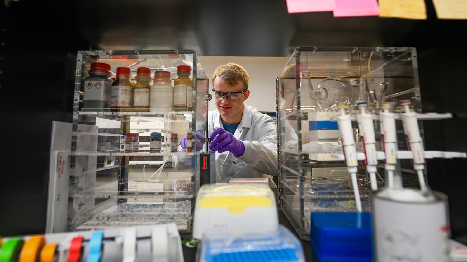 Students work in a laser lab on Centennial campus.