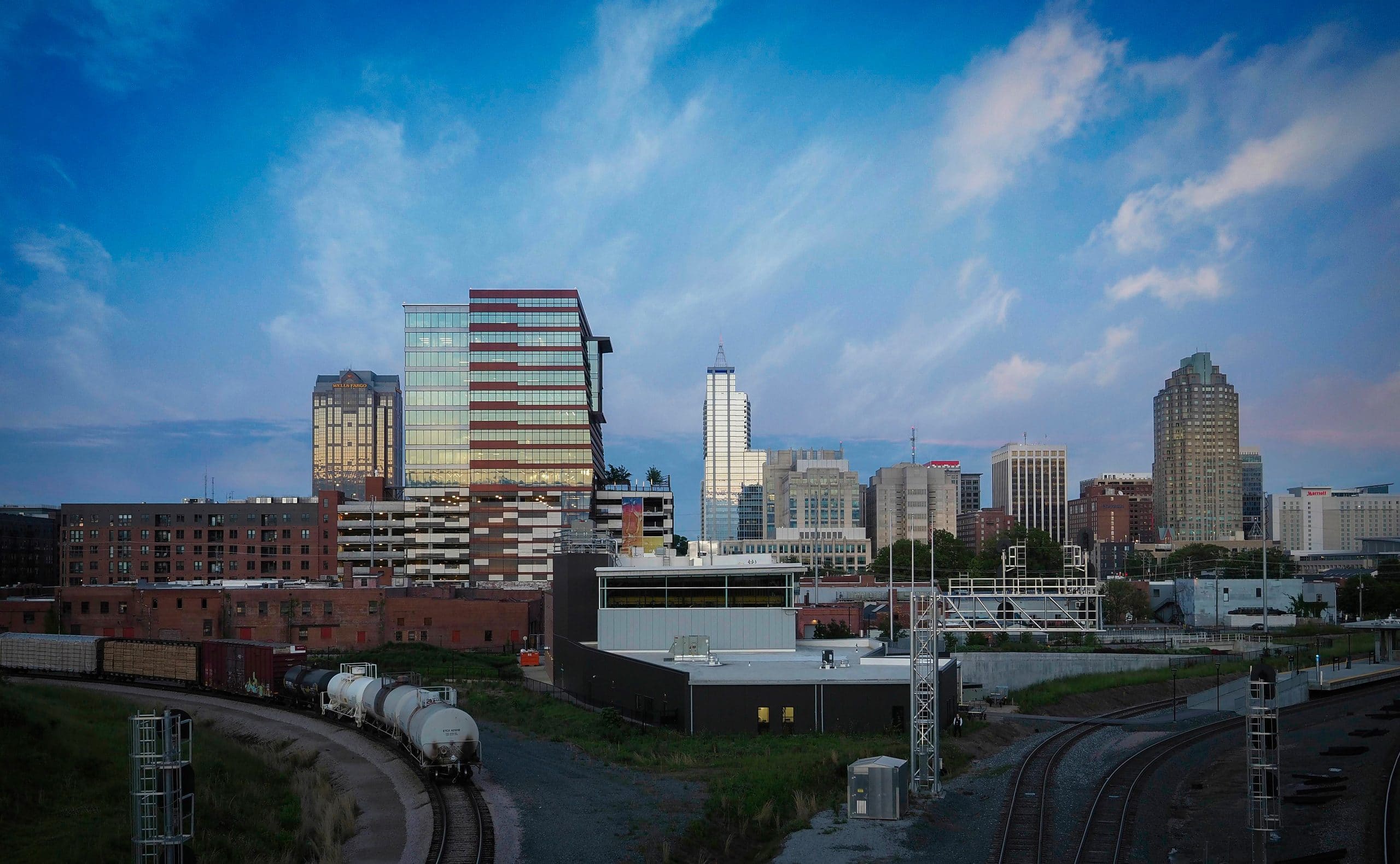 The downtown Raleigh skyline at dusk, as seen from the Boylan street bridge.