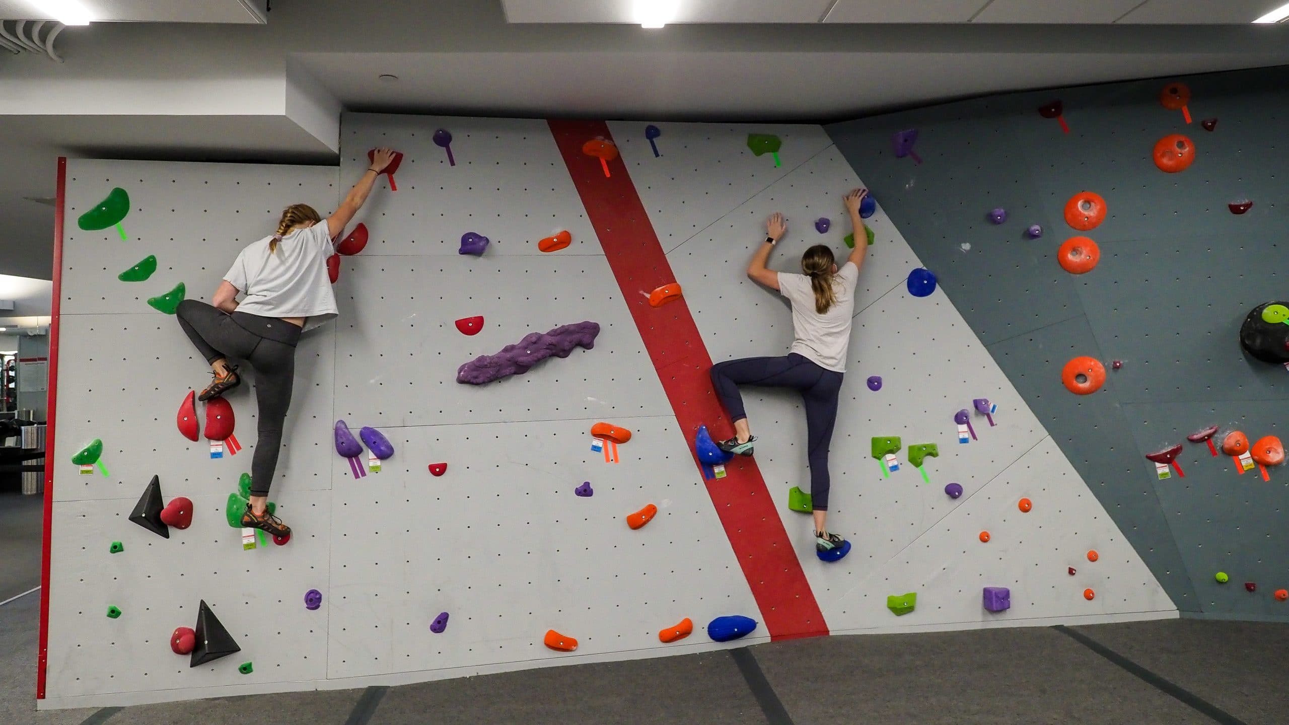 Students practice climbing and bouldering during the COVID-19 pandemic at the newly renovated Carmichael gym.
