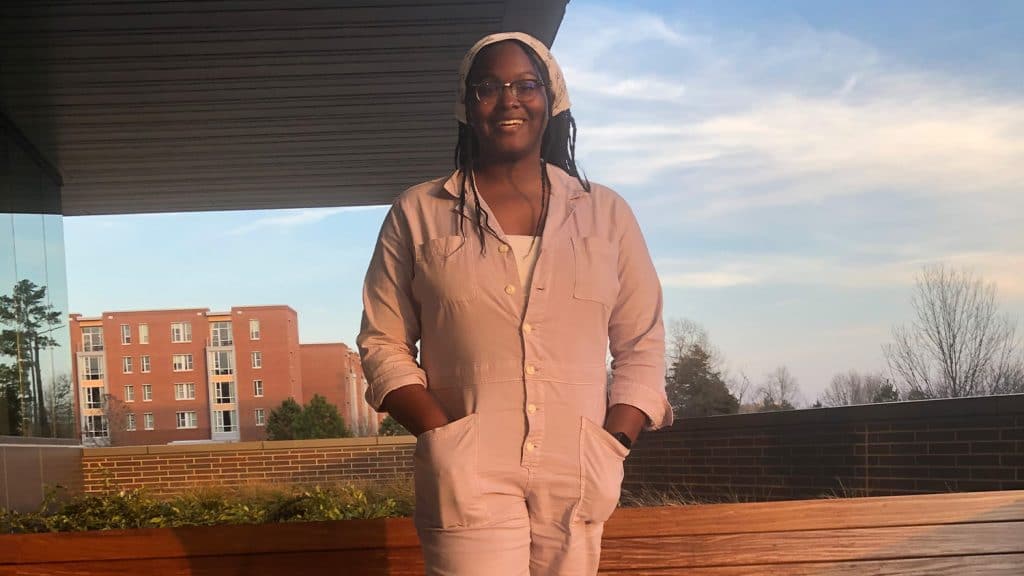 Student Selena Harrison stands on NC State's campus.