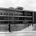 A black and white archival photo shows the exterior of the University Student Center.