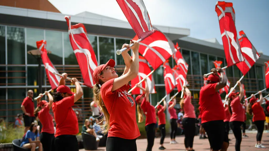 Flag twirlers put on a dazzling show for new NC State students during Wolfpack Welcome Week.