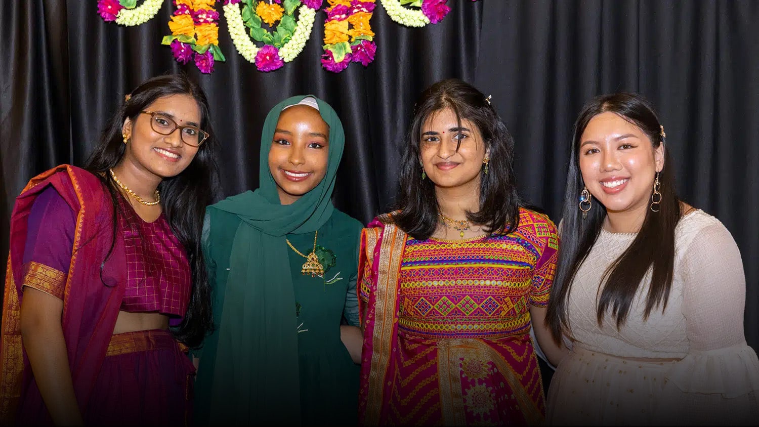 Four NC State students pose at an EKTAA event.