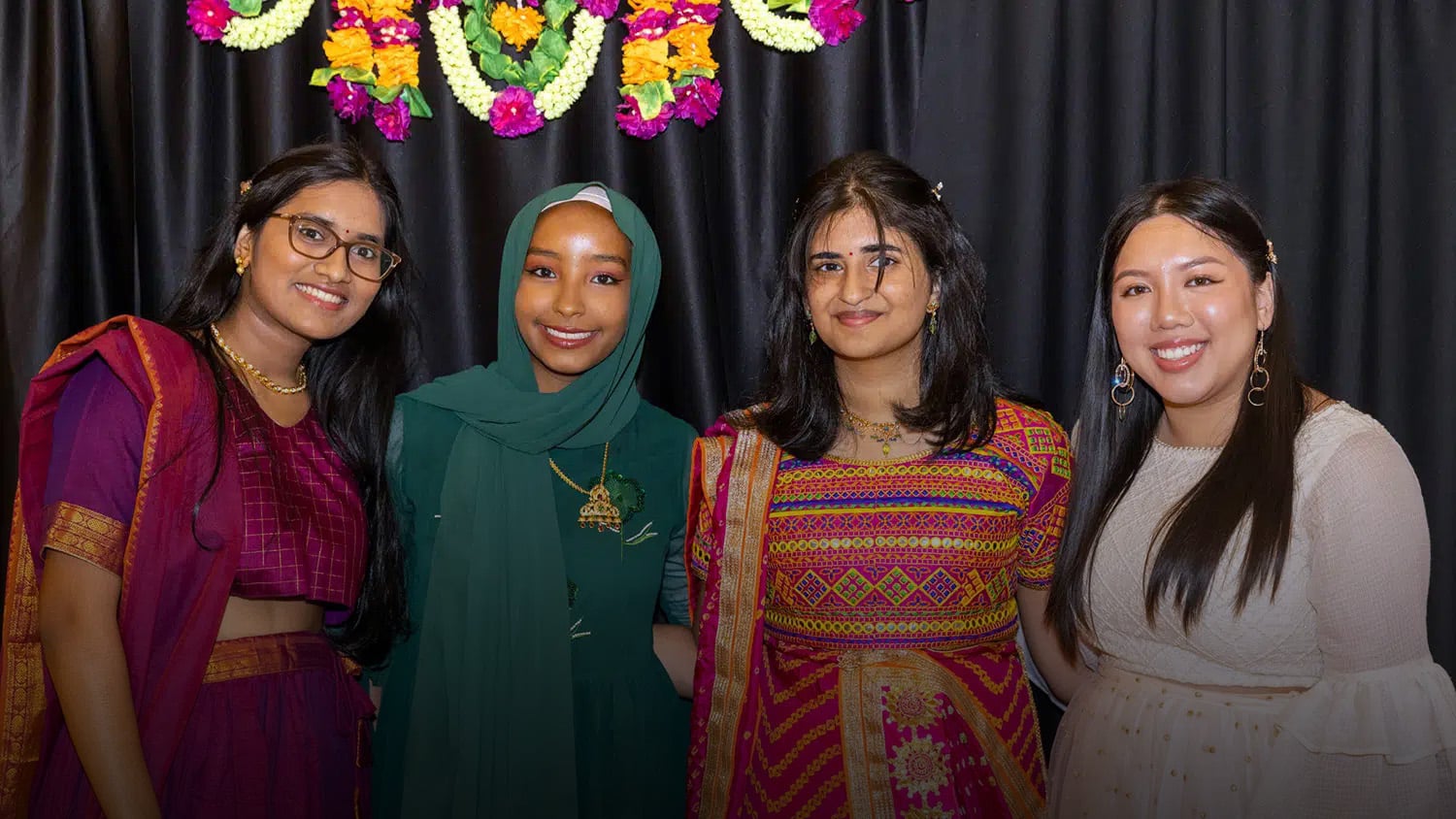 Four NC State students pose at an EKTAA event.
