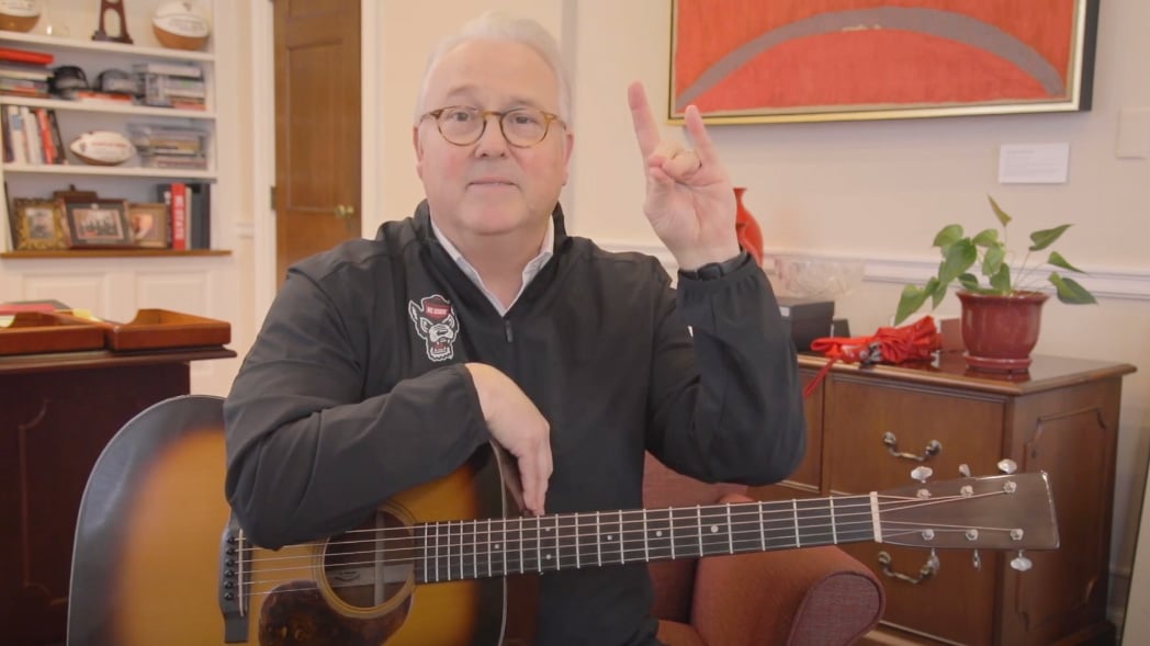 Chancellor Randy Woodson plays his guitar — and shares his gratitude — after a successful Day of Giving.