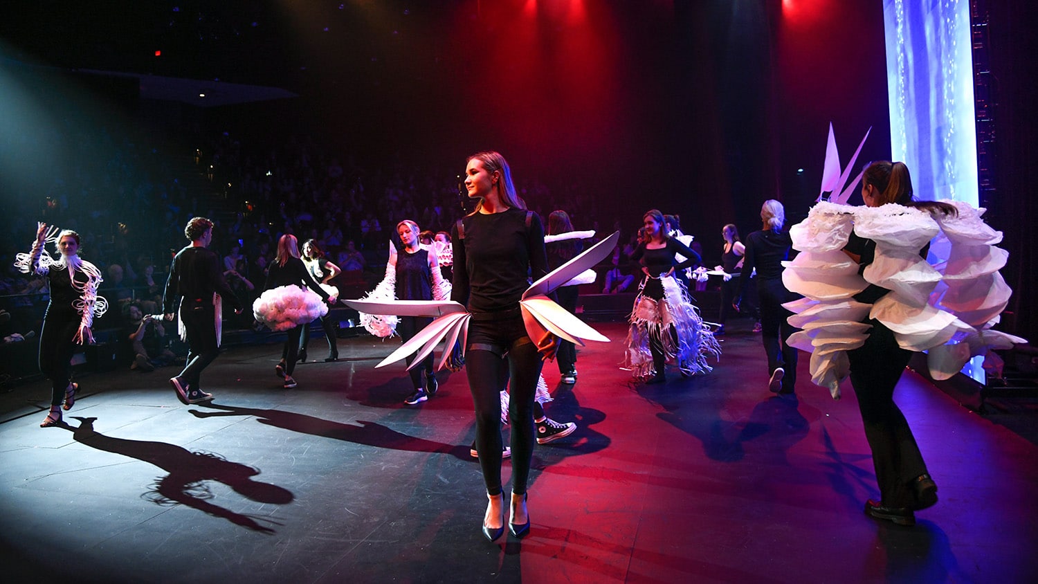 NC State student models and performers on stage during Art2Wear 2023.