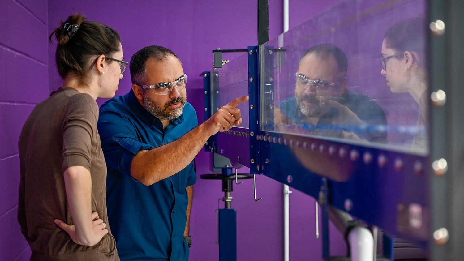 Assitant Professor Tarek Aziz works with a student in the Hydraulics Lab in the Fitts-Woolard building on Centennial Campus.