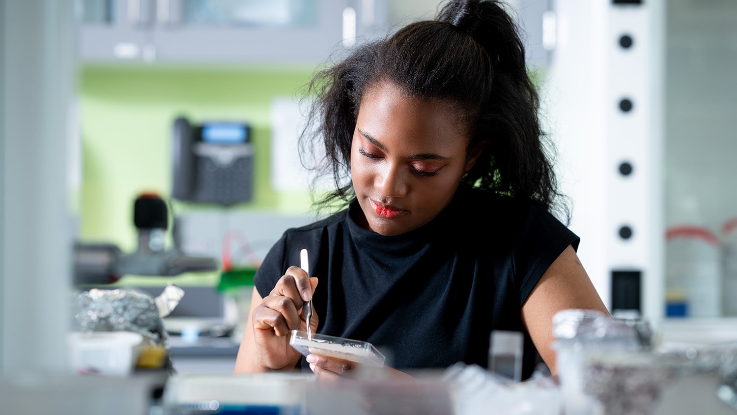 Dr. Imani Madison of the STEPS Center works with plant samples in a lab.