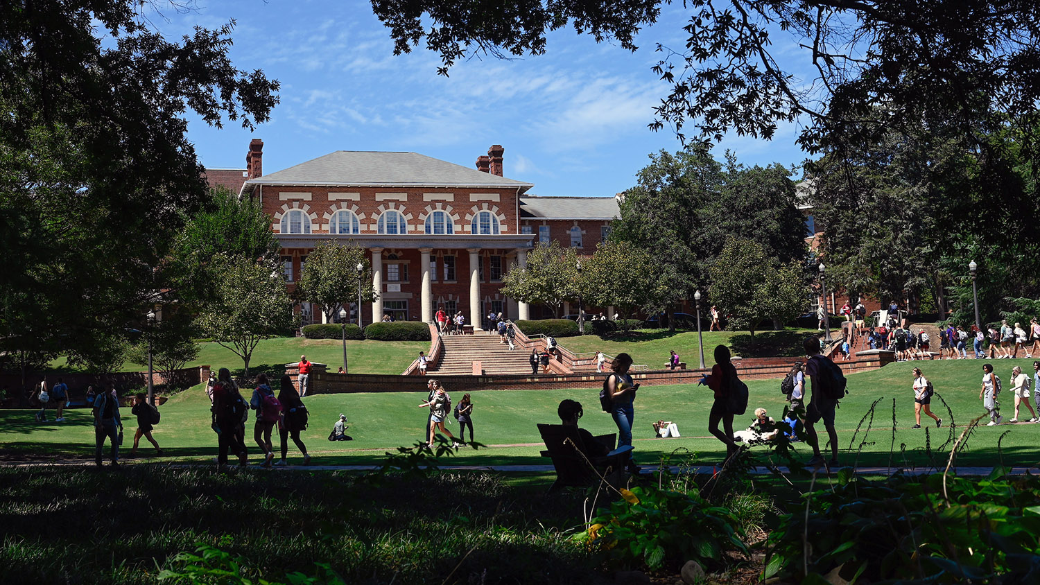 Students make their way across the Court of North Carolina, in front of the 1911 building.