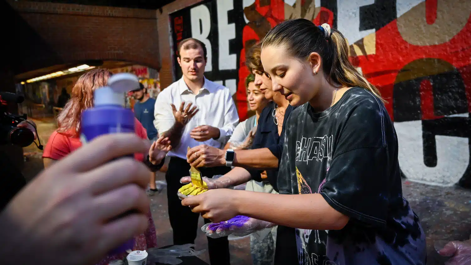 Students work together to paint a mural for Respect the Pack, an annual campus event focused on diversity, equity and inclusion.
