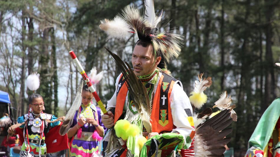 A group participates in a Powwow celebration.