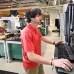 Students work inside the Center for Additive Manufacturing and Logistics (CAMAL) on NC State's Centennial Campus.