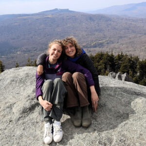 Two student-volunteers pose for a photo at the Blue Ridge Mountains during their alternative service break trip.