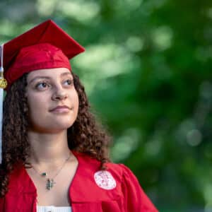 Lexus Silver, a spring 2025 NC State graduate, poses in cap and gown in the leadup to commencement.