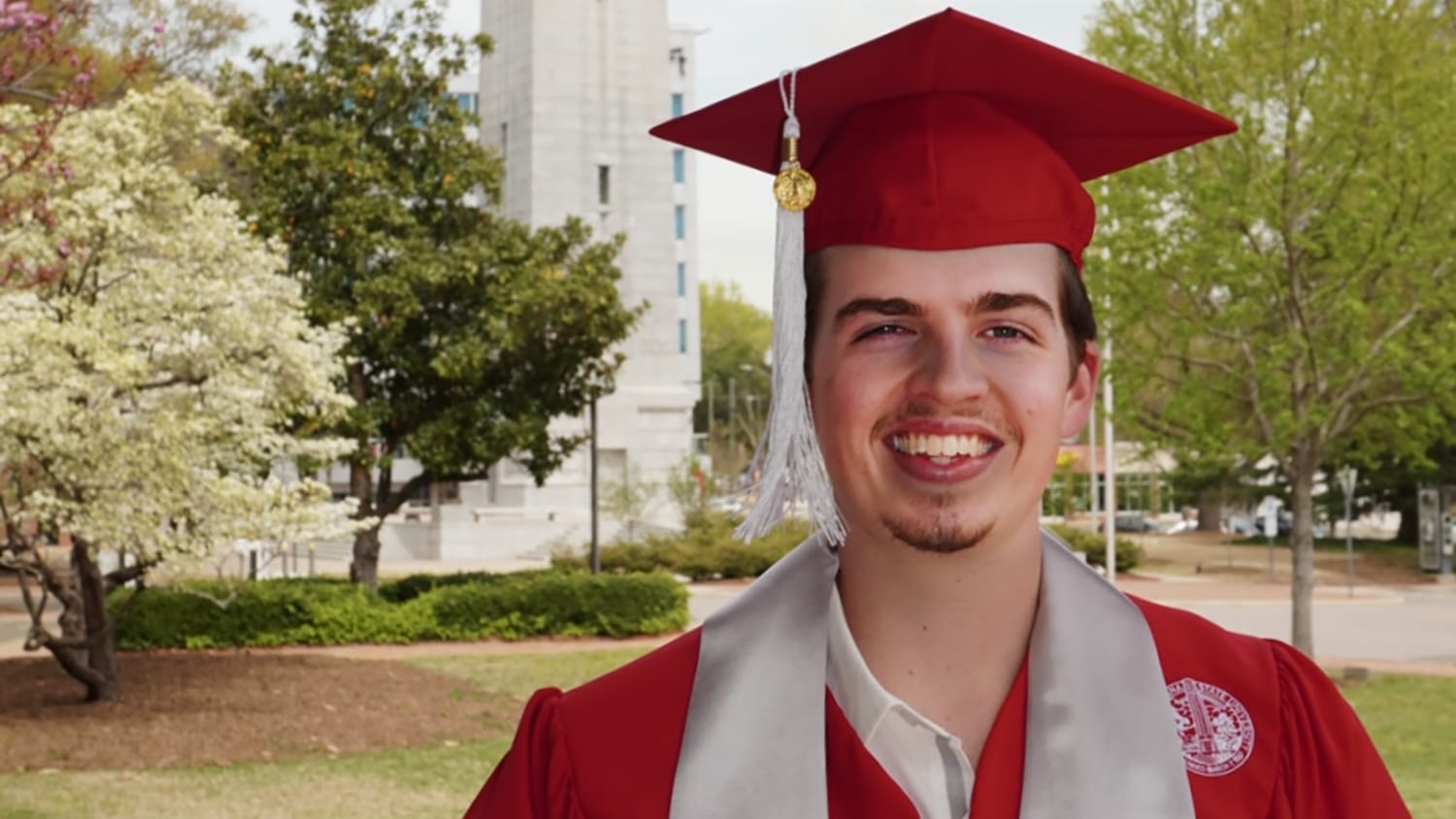 CALS graduate Clark Roberts in his red robes.