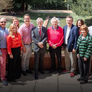 Three generations of the Wilson family celebrating the anniversary of their naming gift with Dean Hinks and the Wufs.