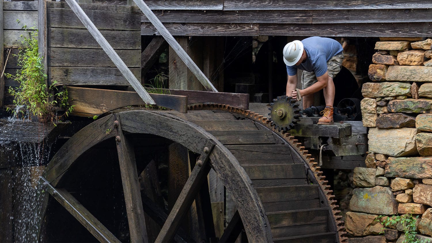The old wheel at Yates Mill being removed.