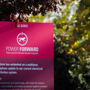 An informational sign on campus about the Power Forward project.