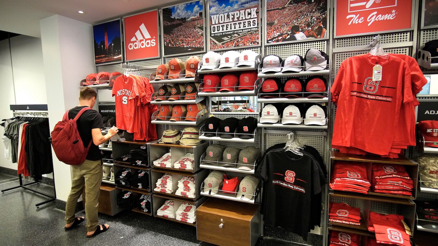 A student shops at Wolfpack Outfitters at Talley Student Union.