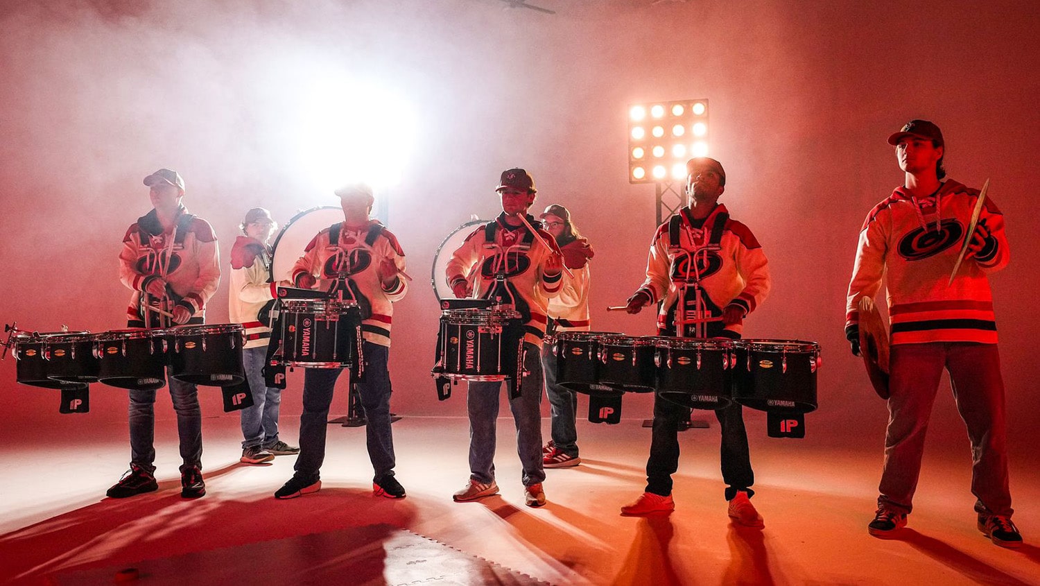 Members of the NC State Marching Band play the drums in the Carolina Hurricanes' jersey reveal video.