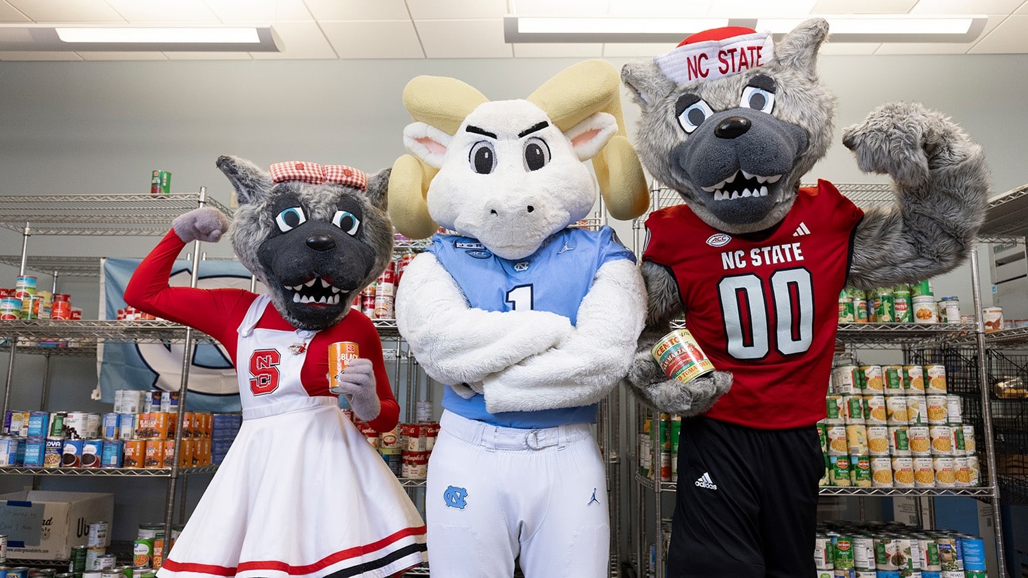 The Wufs pose with Rameses, UNC's mascot, in a campus food pantry.