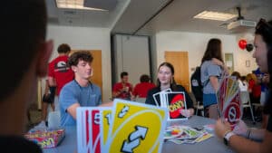 Students play a game of UNO during Wolfpack Welcome Weeks.